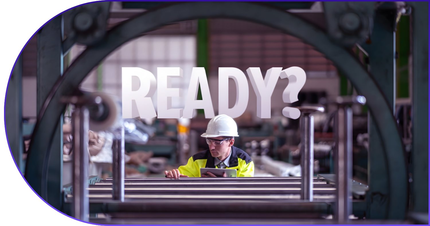 a factory worked in a white helmet and yellow jacket and the text READY